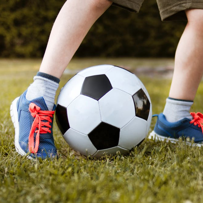 boy playing with soccer ball
